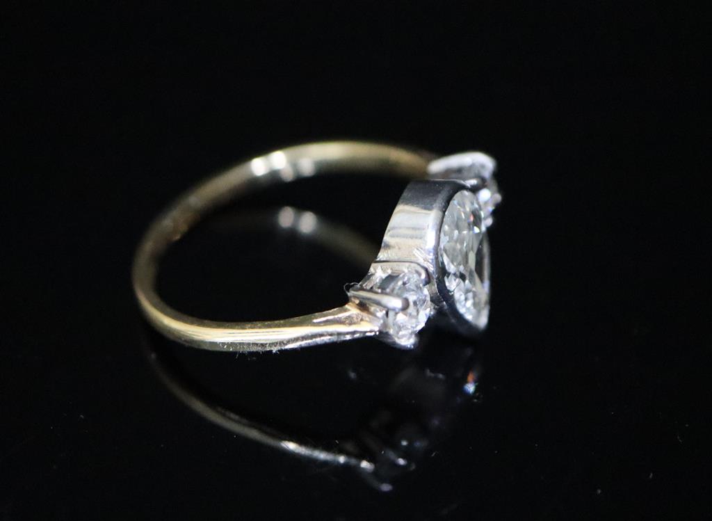 A gold and three stone diamond ring,